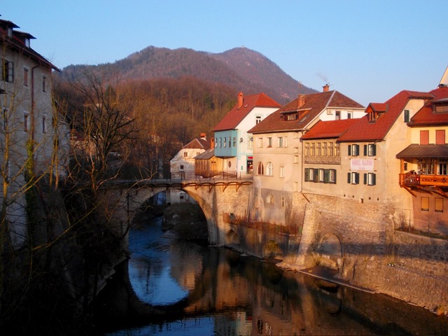 Classic edge of old town panorama: with the 14th Century Stone Capuchin's bridge--and the Hotel Garni Paleta-with rooms overlooking the Selška Sora river